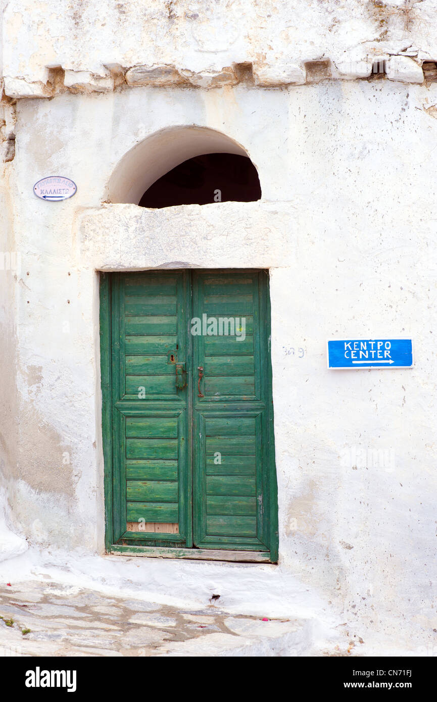Green double door of an old whitewashed house in Hora, on the Greek Cyclade island of Amorgos. Stock Photo