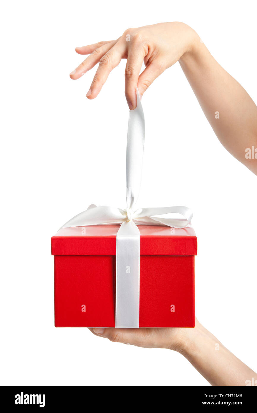 Download Hand Holding Ribbon And Open Gift Box Stock Photo Alamy Yellowimages Mockups