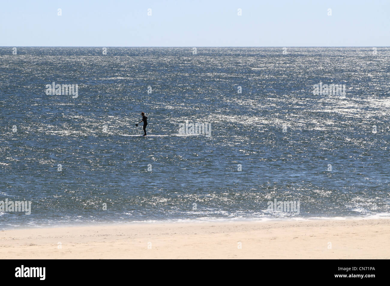 A Paddle Surfer in the Atlantic Ocean. Long Branch, New Jersey, USA Stock Photo