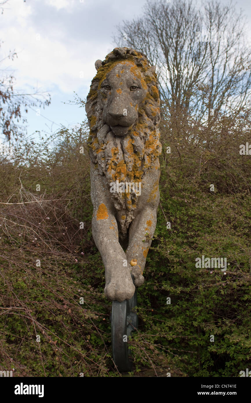 Part of the concrete sculpture “The Gardener & Truant Lion” by Sioban Coppinger was commissioned by British Rail in 1986. Stock Photo