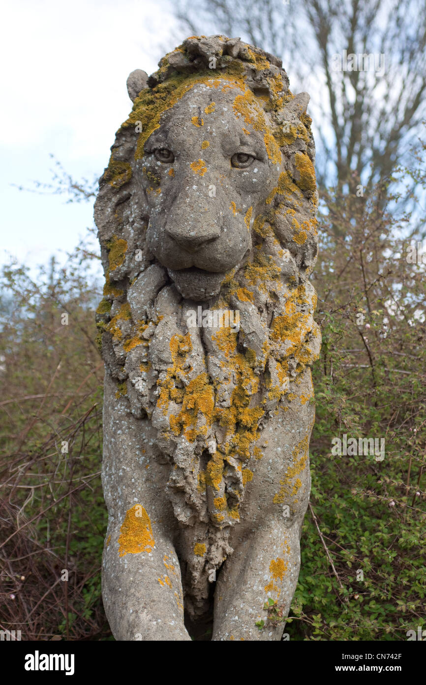 Part of the concrete sculpture “The Gardener & Truant Lion” by Sioban Coppinger was commissioned by British Rail in 1986. Stock Photo