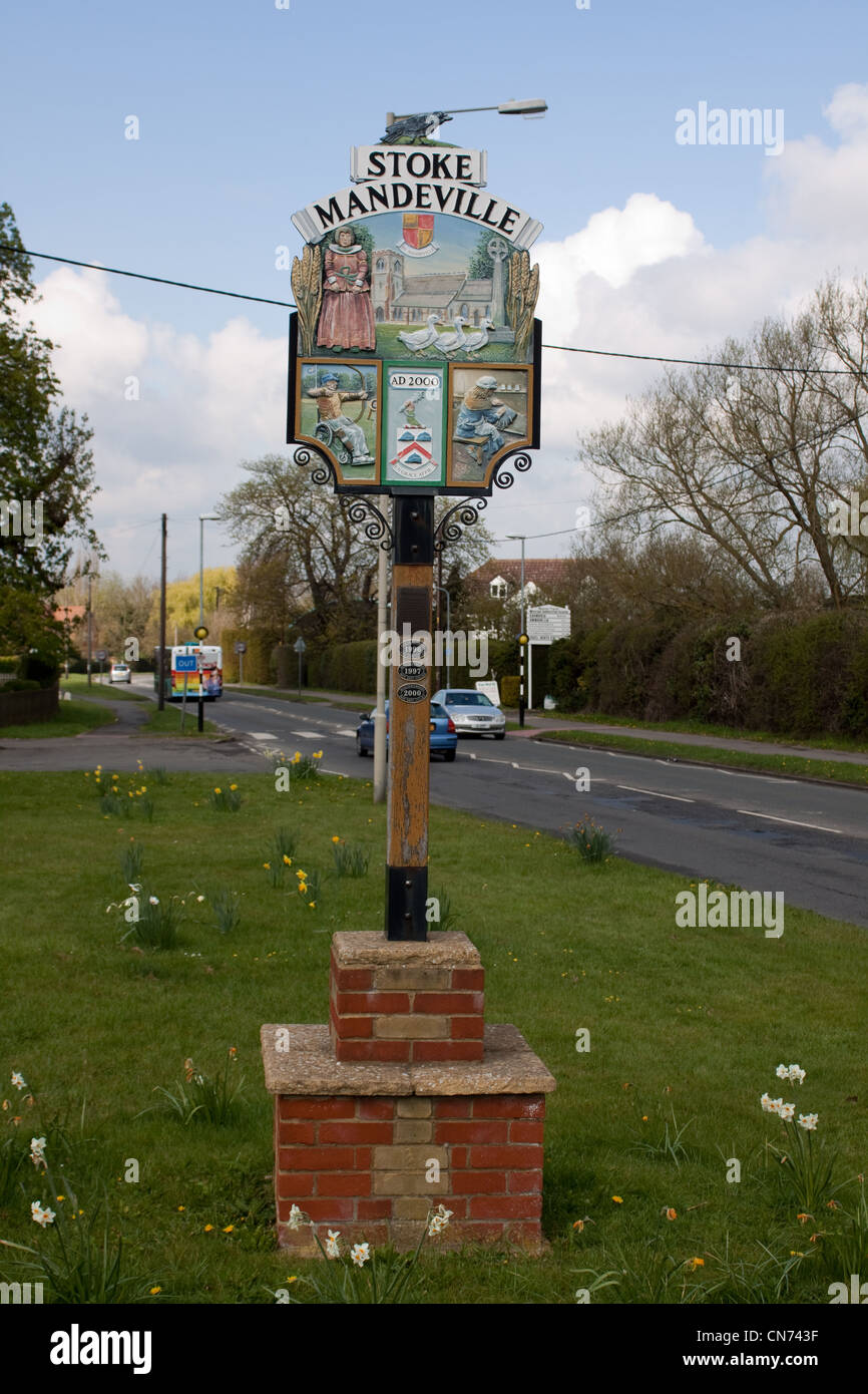 Stoke Mandeville Millennium sign. The sign shows aspects of village life over the centuries. Stock Photo