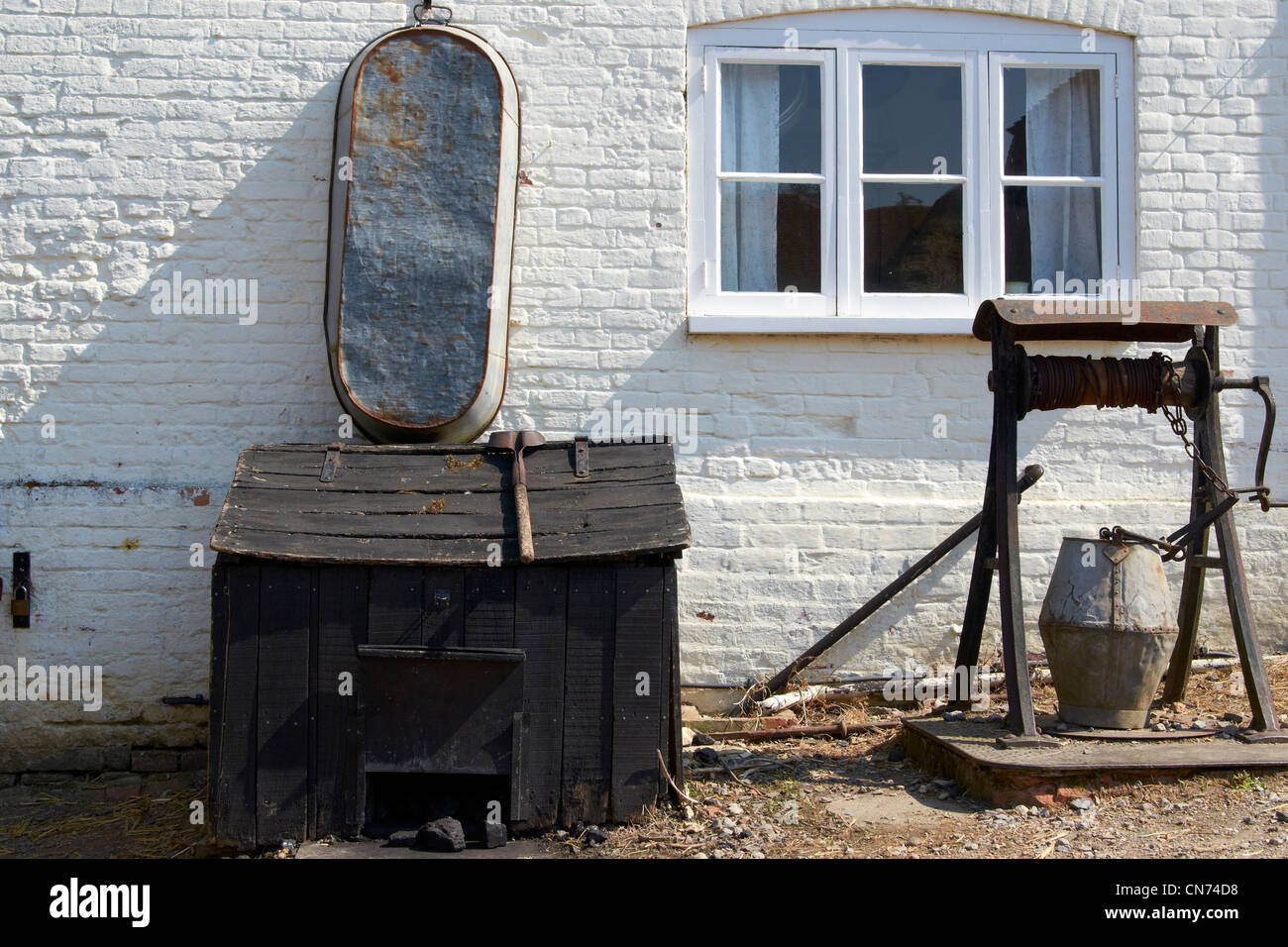 Coal bunker, tin bath and well outside the historic farmhouse at Manor
