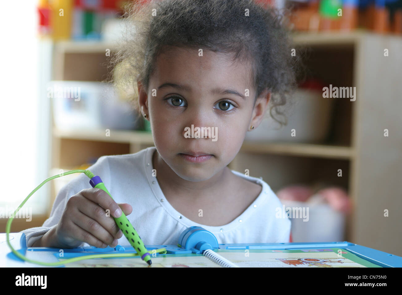 Girl using Electronic Learning Book Stock Photo Alamy
