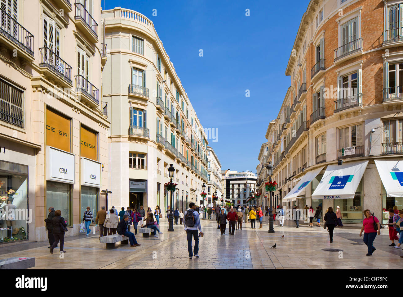 Shops on Calle Marques de Larios, the main shopping street, Malaga, Andalucia, Spain Stock Photo