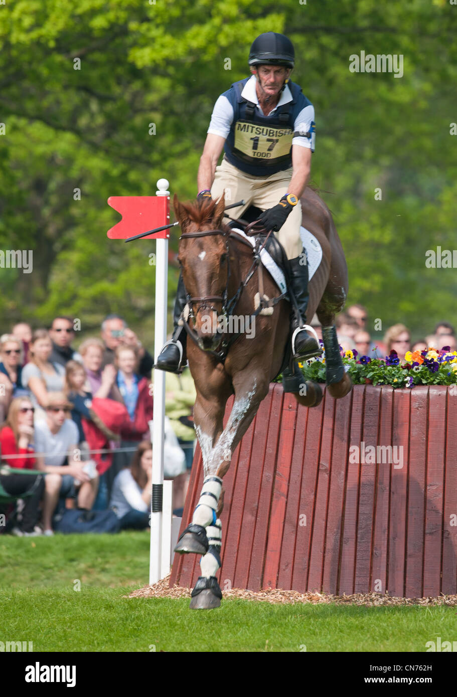 Mark Todd and Major Milestone during the cross country phase of the Mitsubishi Motors Badminton Horse Trials 2011. Stock Photo