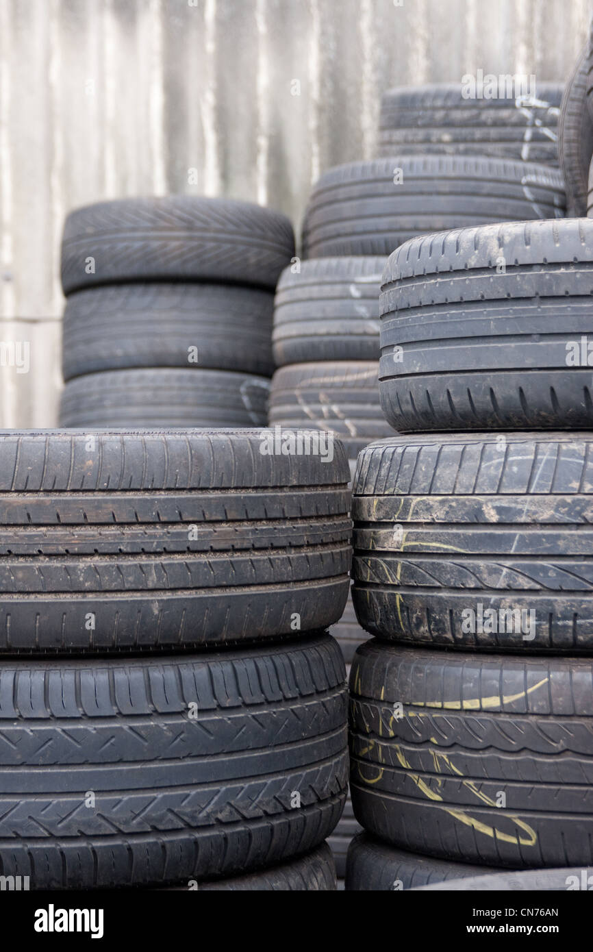 Car Tyres stacked in a distribution centre Stock Photo Alamy