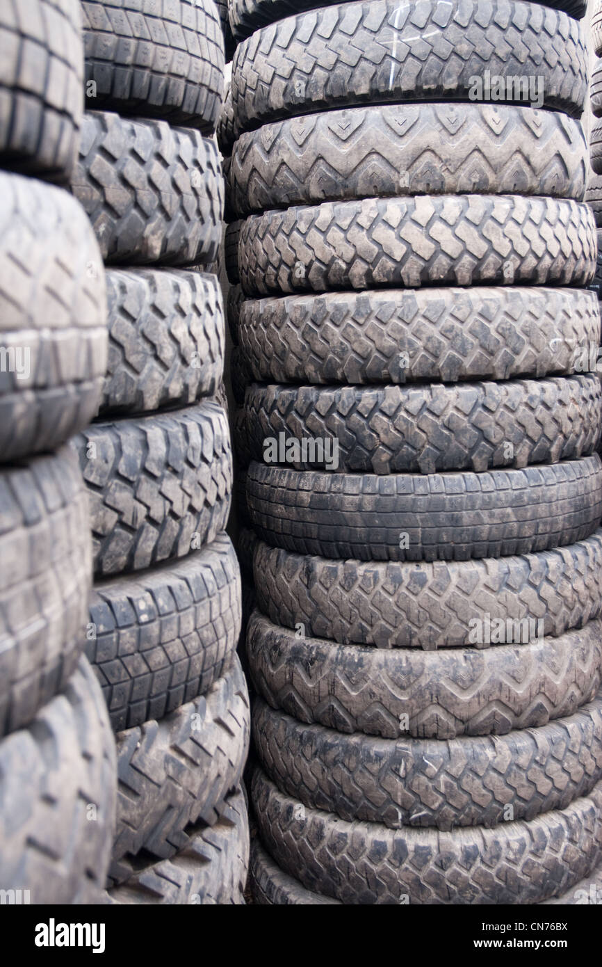 Car Tyres stacked in a distribution centre Stock Photo Alamy