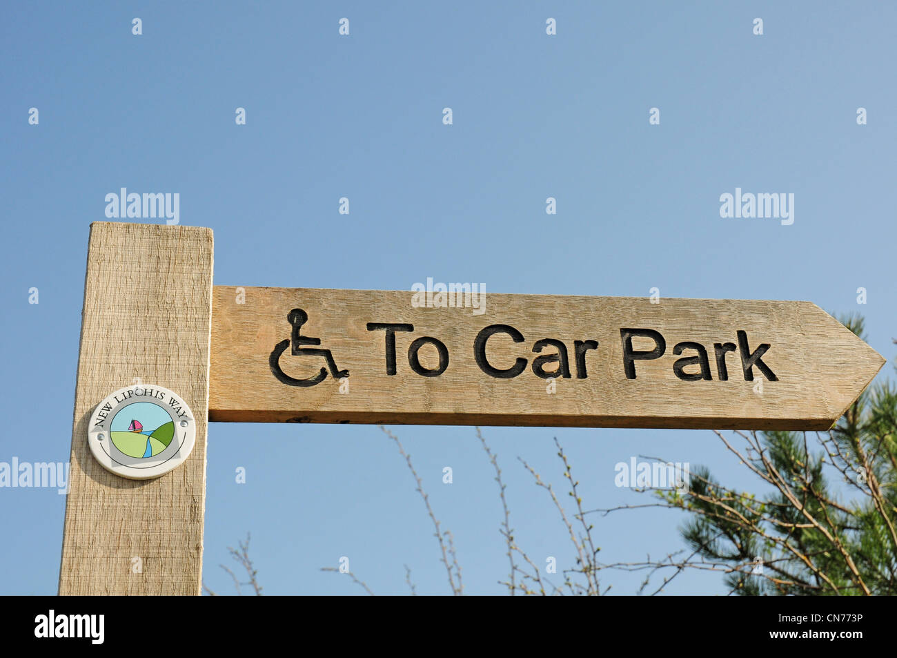Finger post sign denoting wheelchair access to car park from West Itchenor. Stock Photo