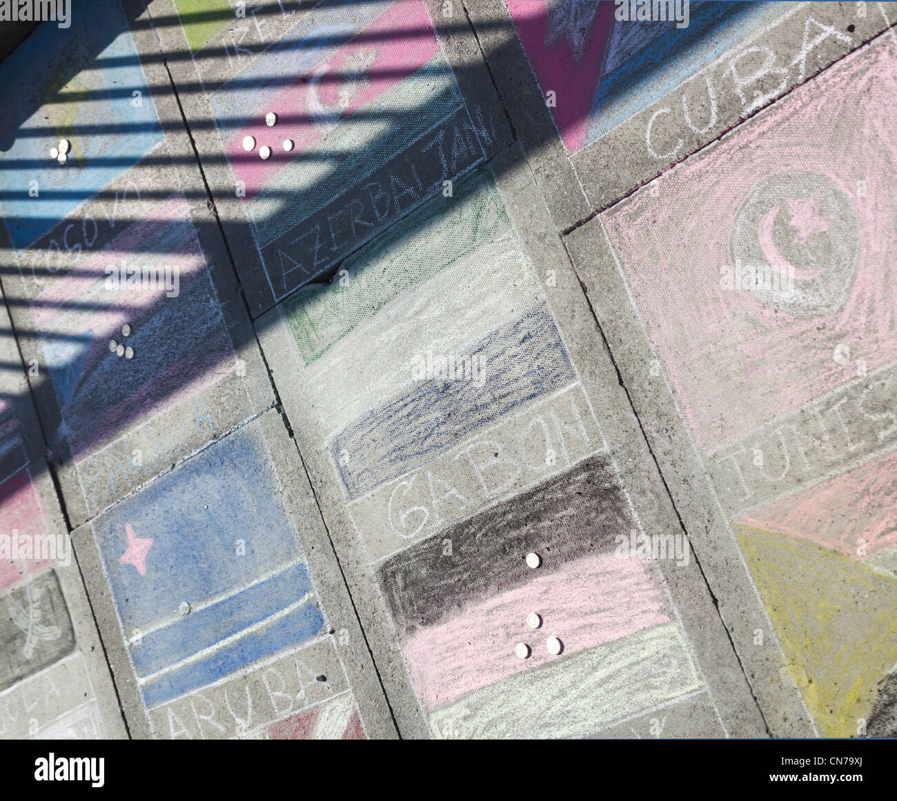 Chalk pavement drawing of flags of Cuba, Gabon, Aruba, Tunisia, at the South Bank in London Stock Photo