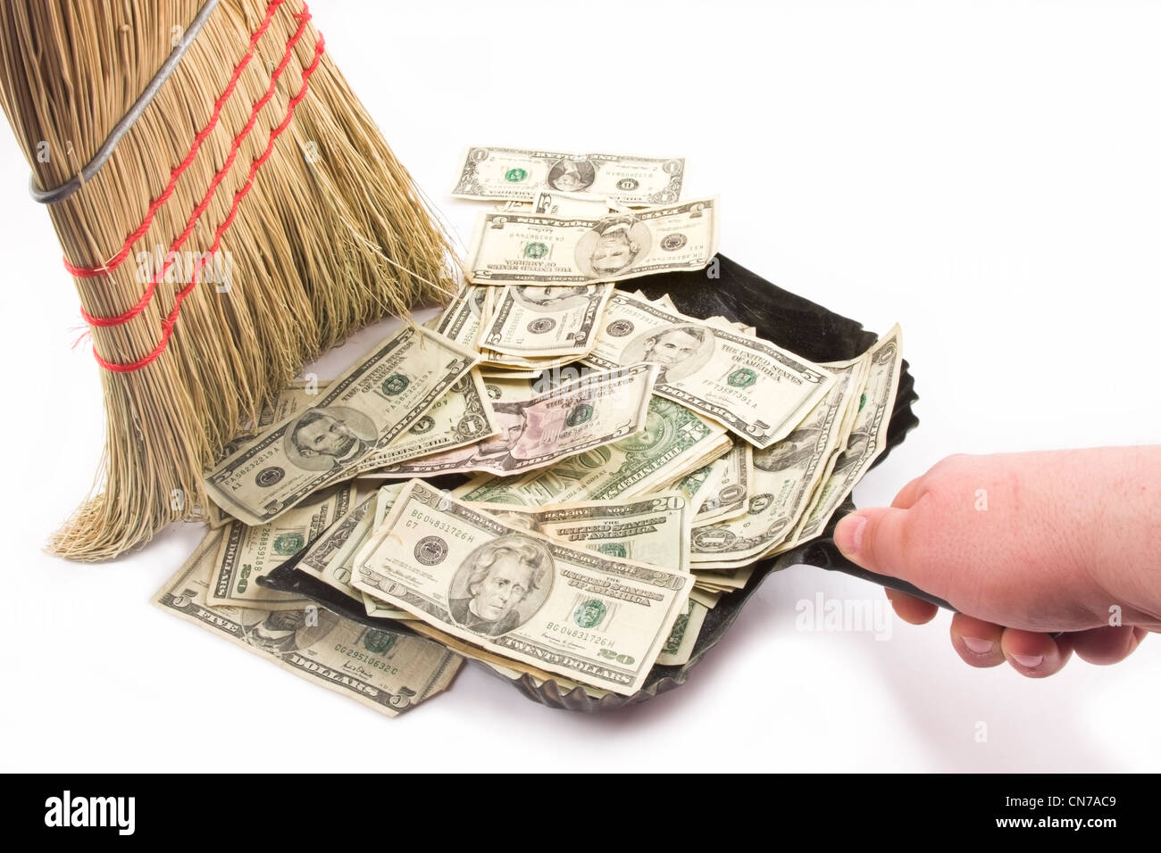 Sweeping up American money Stock Photo Alamy