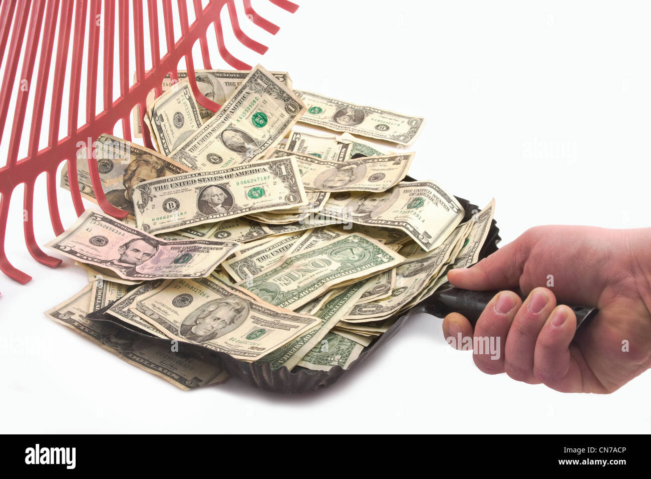 Raking up American cash money Stock Photo Alamy