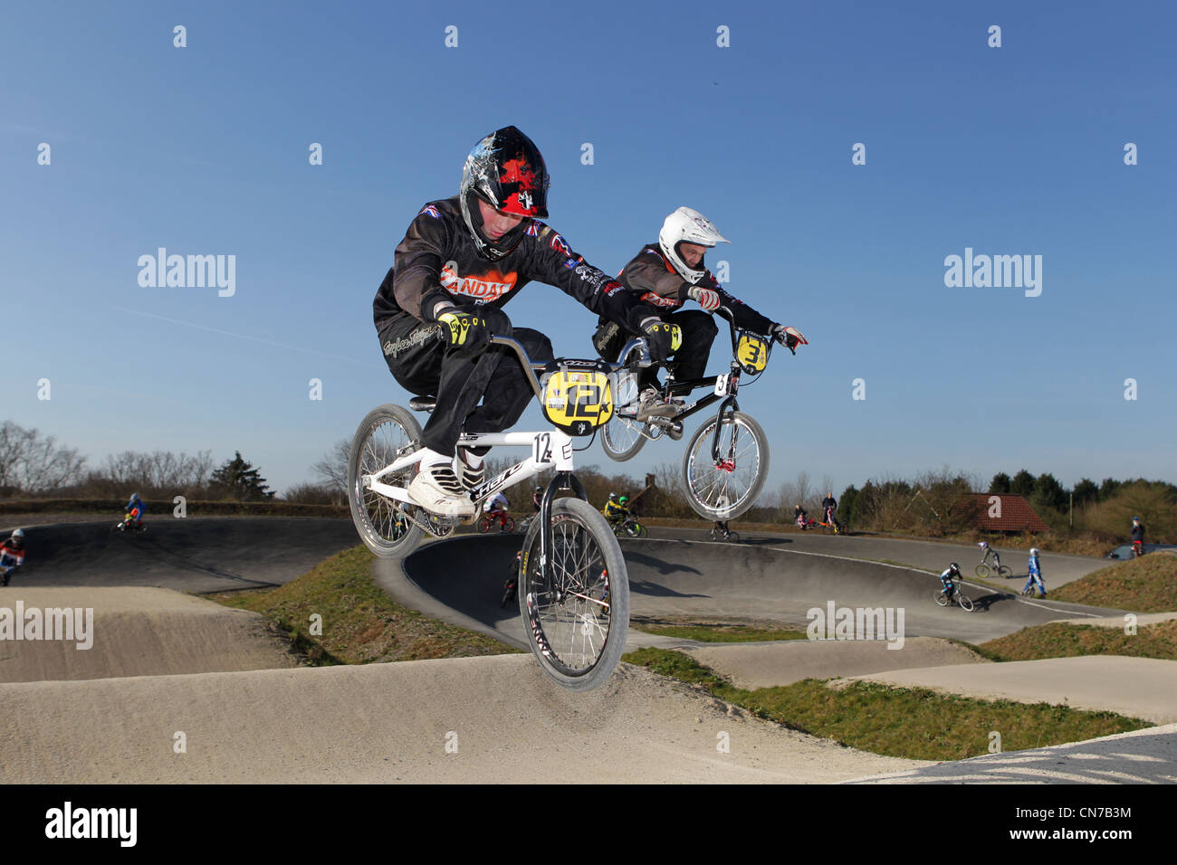 Two bmx riders jumping Stock Photo Alamy