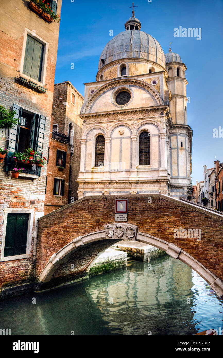 Church of Santa Maria dei Miracoli, in Venice, by a canal Stock Photo