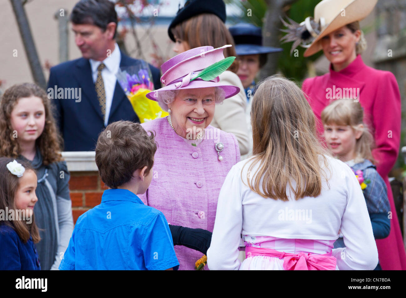 Her Majesty Queen Elizabeth II smiling with members of the Royal Family at Windsor Castle Easter Sunday 2012. PER0154 Stock Photo