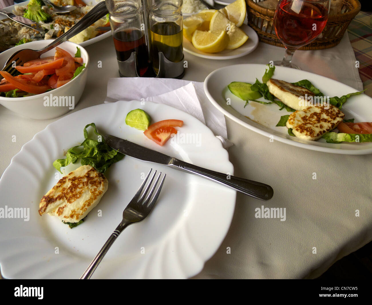 Cypriot Halloumi cheese and fresh vegetables and lemon served at a fish