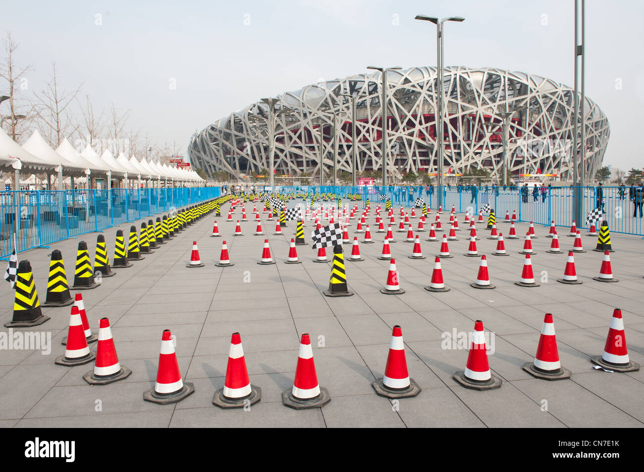 Beijing, Bird's Nest. In the foreground pylons marking a temporary track for cart racing. Stock Photo