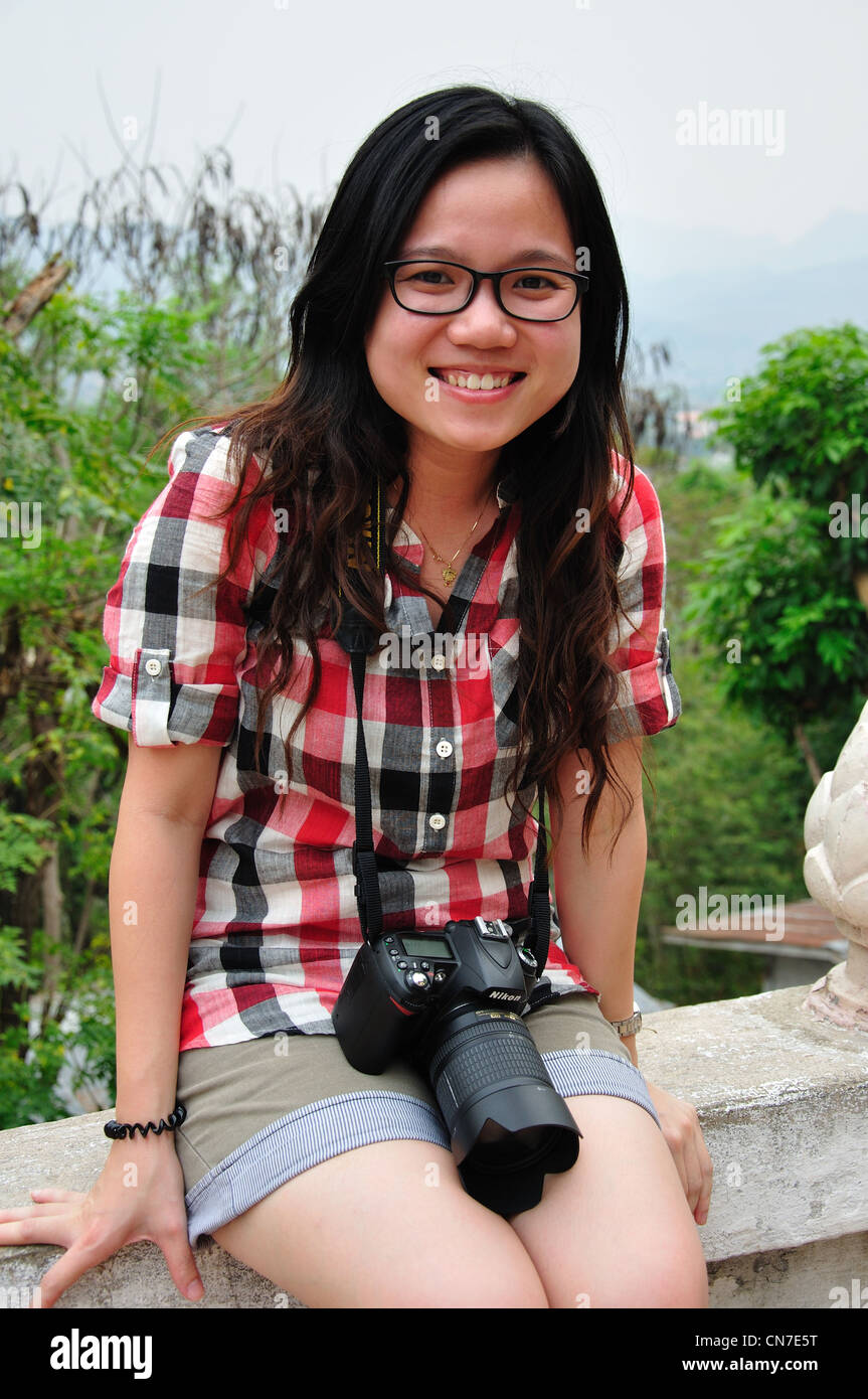 Young Asian female tourist on Mount Phou Si, Luang Prabang, Luang Prabang Province, Laos Stock Photo