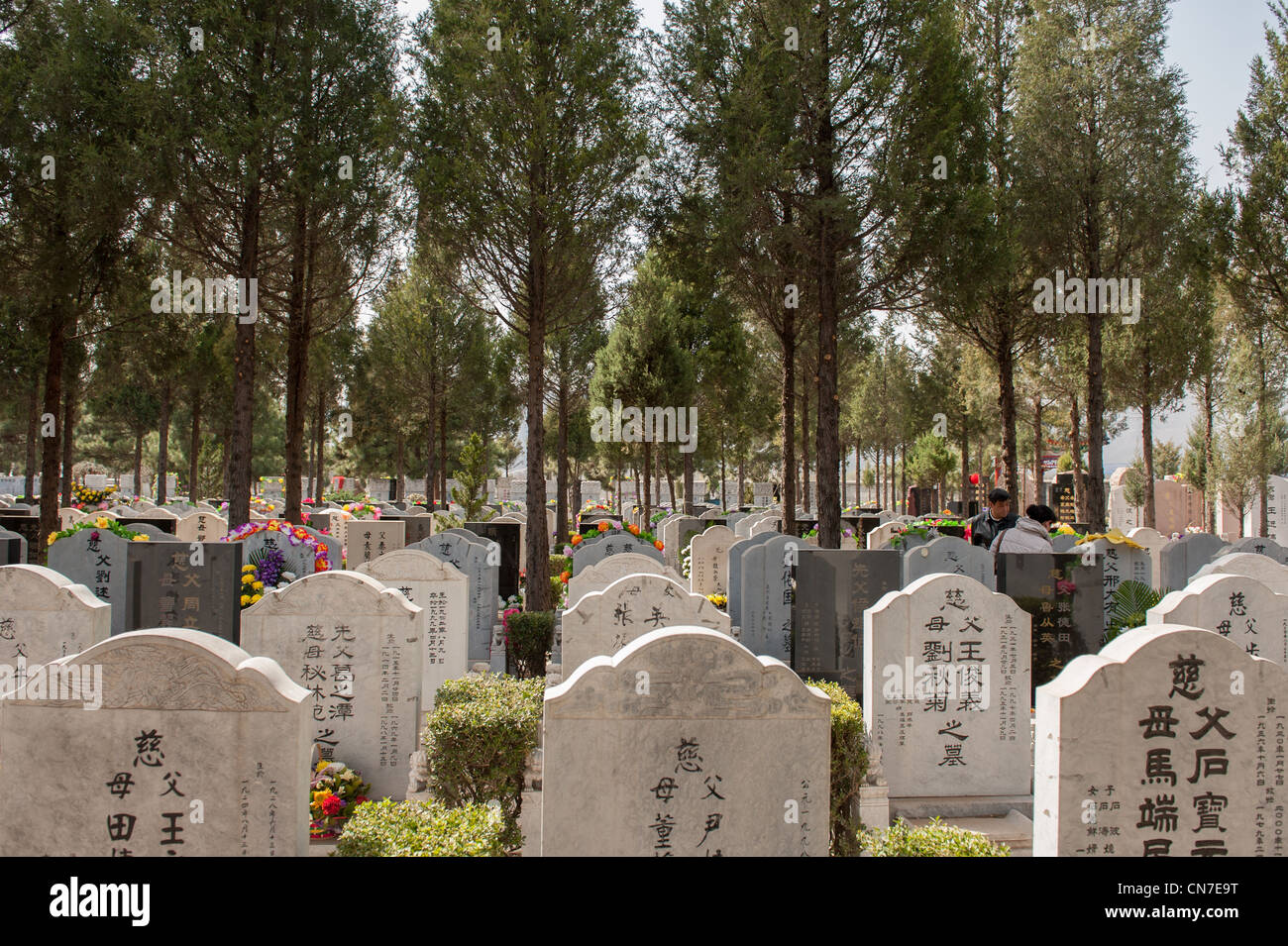 Beijing, Wanan cemetery. Graves with flowers during the Chinese national holiday 'Tomb Sweeping Day' Stock Photo