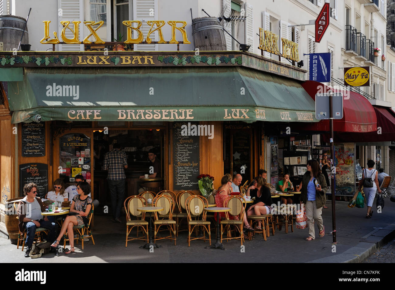 France, Paris, Montmartre, Rue Lepic, brasserie Lux Ba, terrace and pedestrians Stock Photo