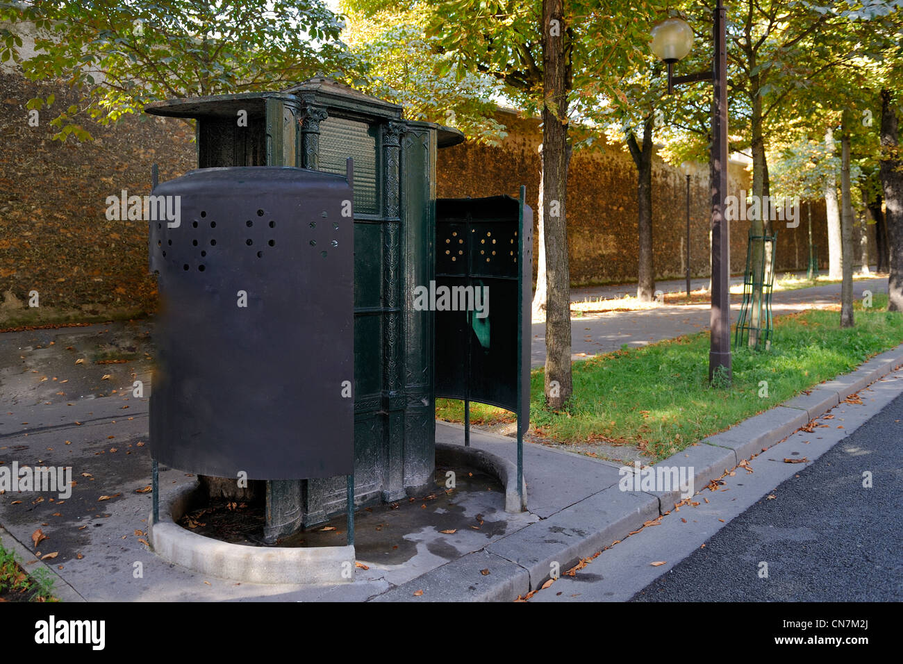 France, Paris, the last street urinal in Haussmann style on the Boulevard Arago, in front of the Prison de la Sante Jail Stock Photo