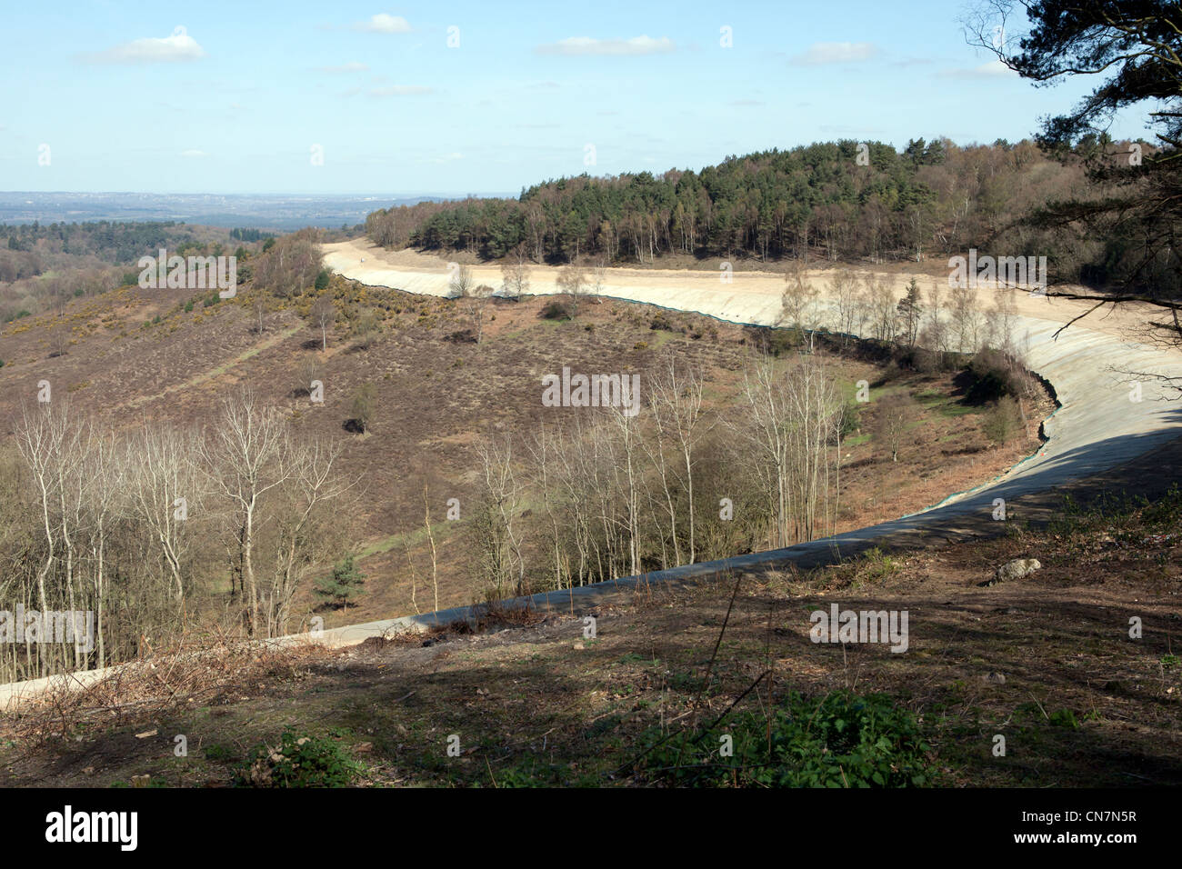 The old A3 road around the Devil's Punchbowl at Hindhead, now covered and planted with seeds and shrubs to return it to nature Stock Photo
