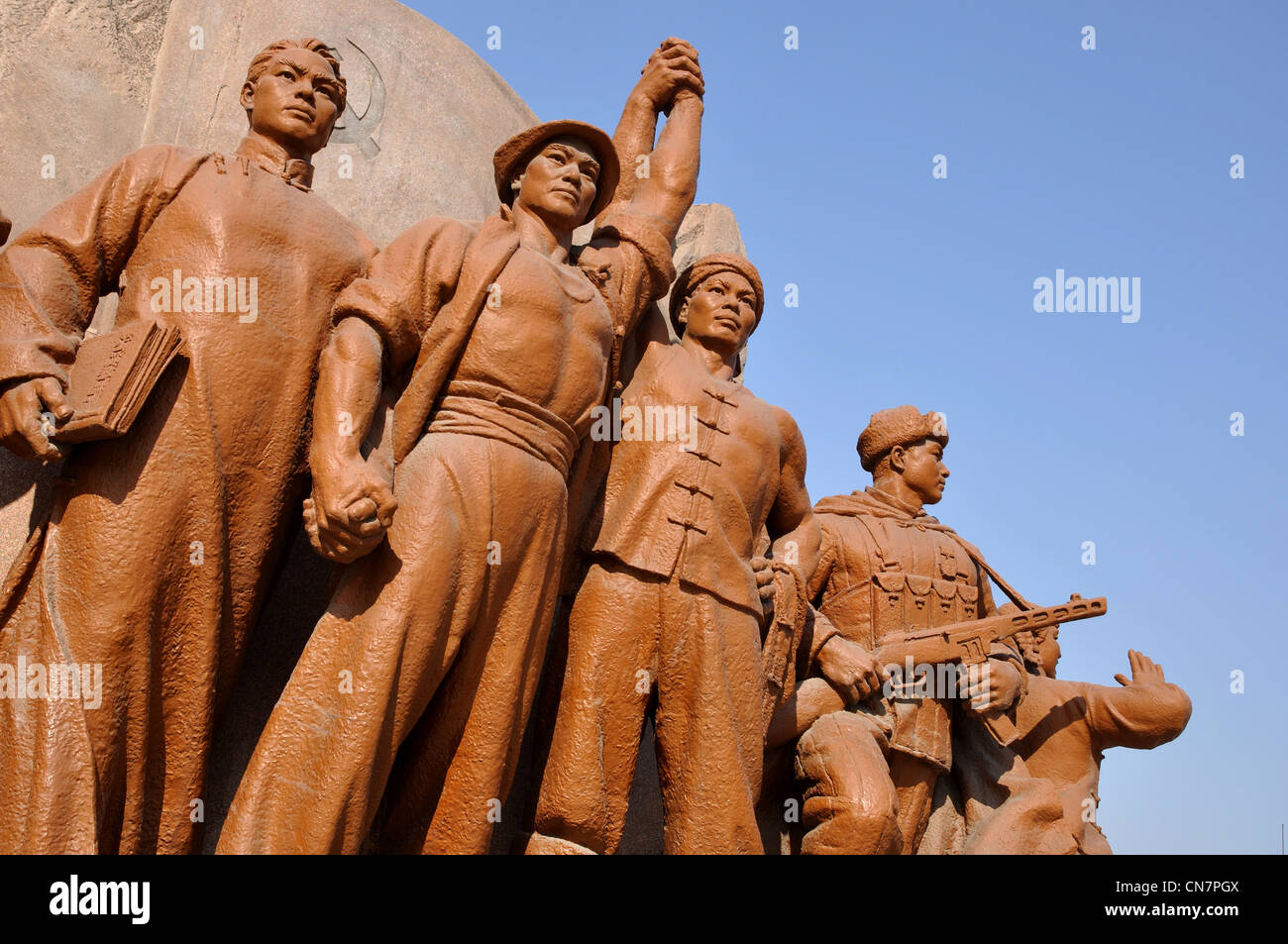 Heroes at the base of the Mao Zedong (or tse Tung) statue, Zhongshan Square, Shenyang, Liaoning, China. Stock Photo