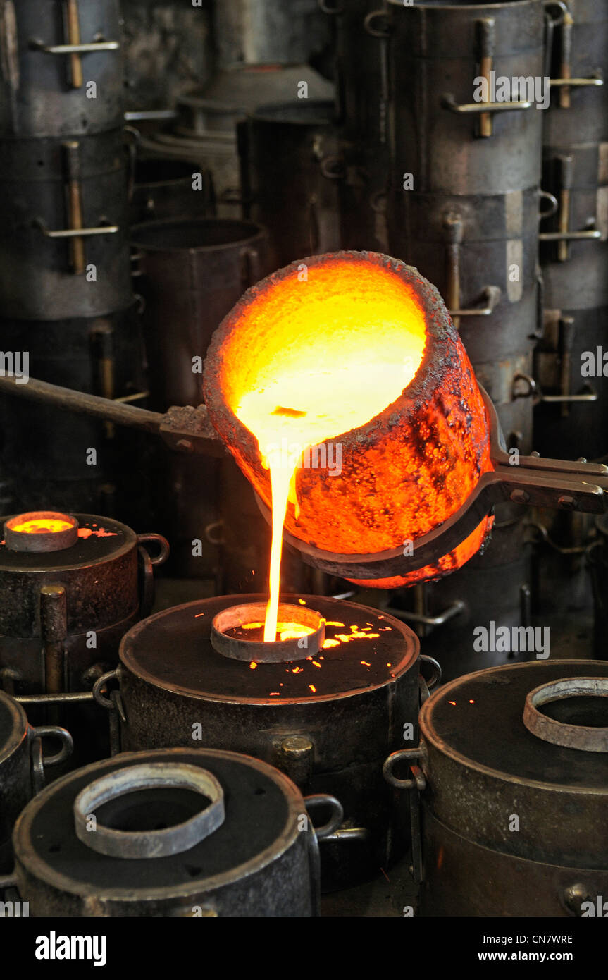 France, Doubs, Labergement Sainte Marie, Bell foundry, Charles Obertino, flows of molten bronze into molds Stock Photo