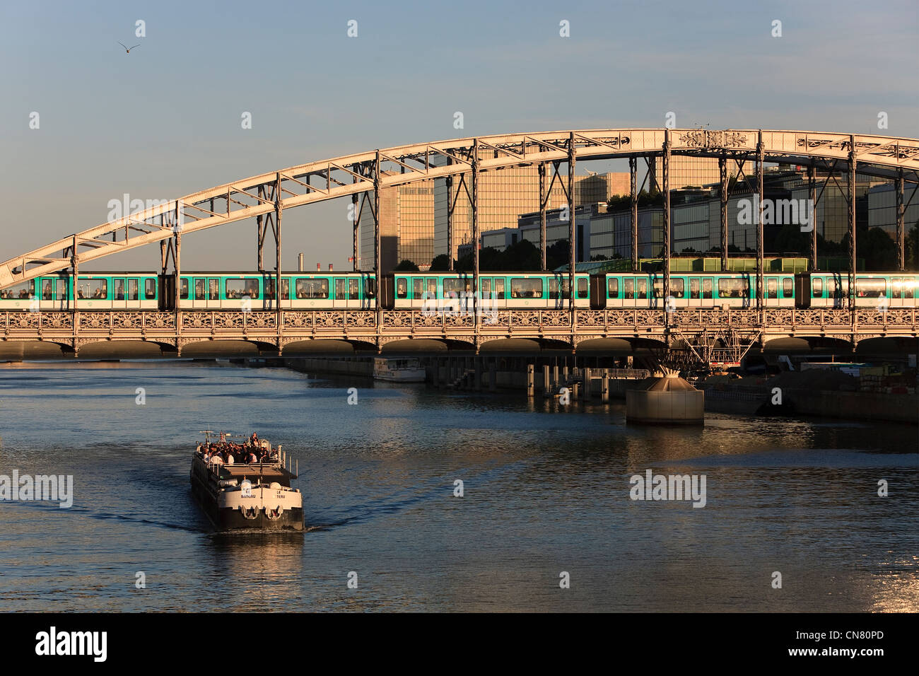 France, Paris, boats on the Seine river under the Viaduc d'Austerlitz, line 5 of the Metro and Bibliotheque Nationale de France Stock Photo