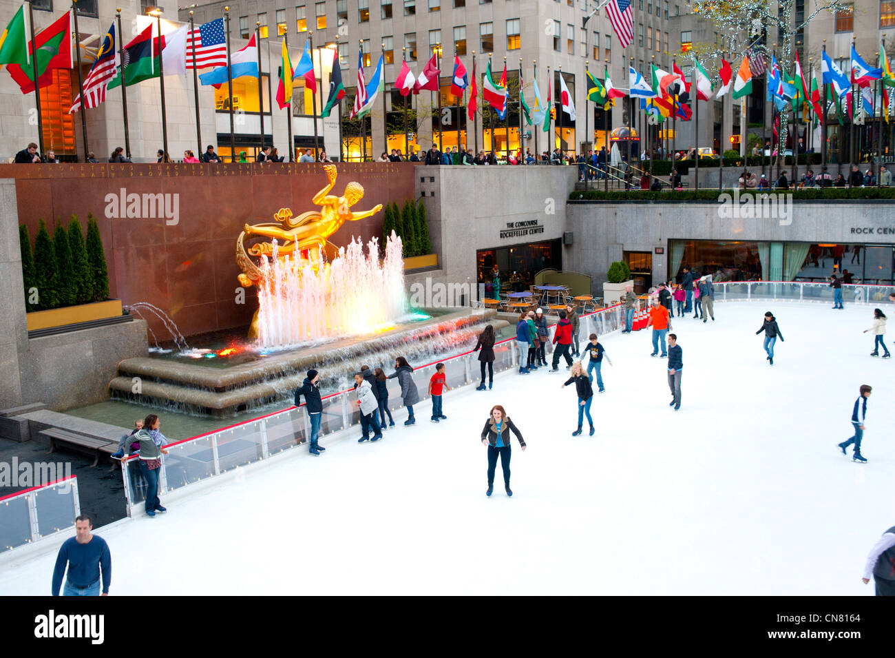 USA  New York City Rockefeller Center Ice Skating Rink winter fun outdoors skate 30 rock NBC  Prometheus Statue Stock Photo