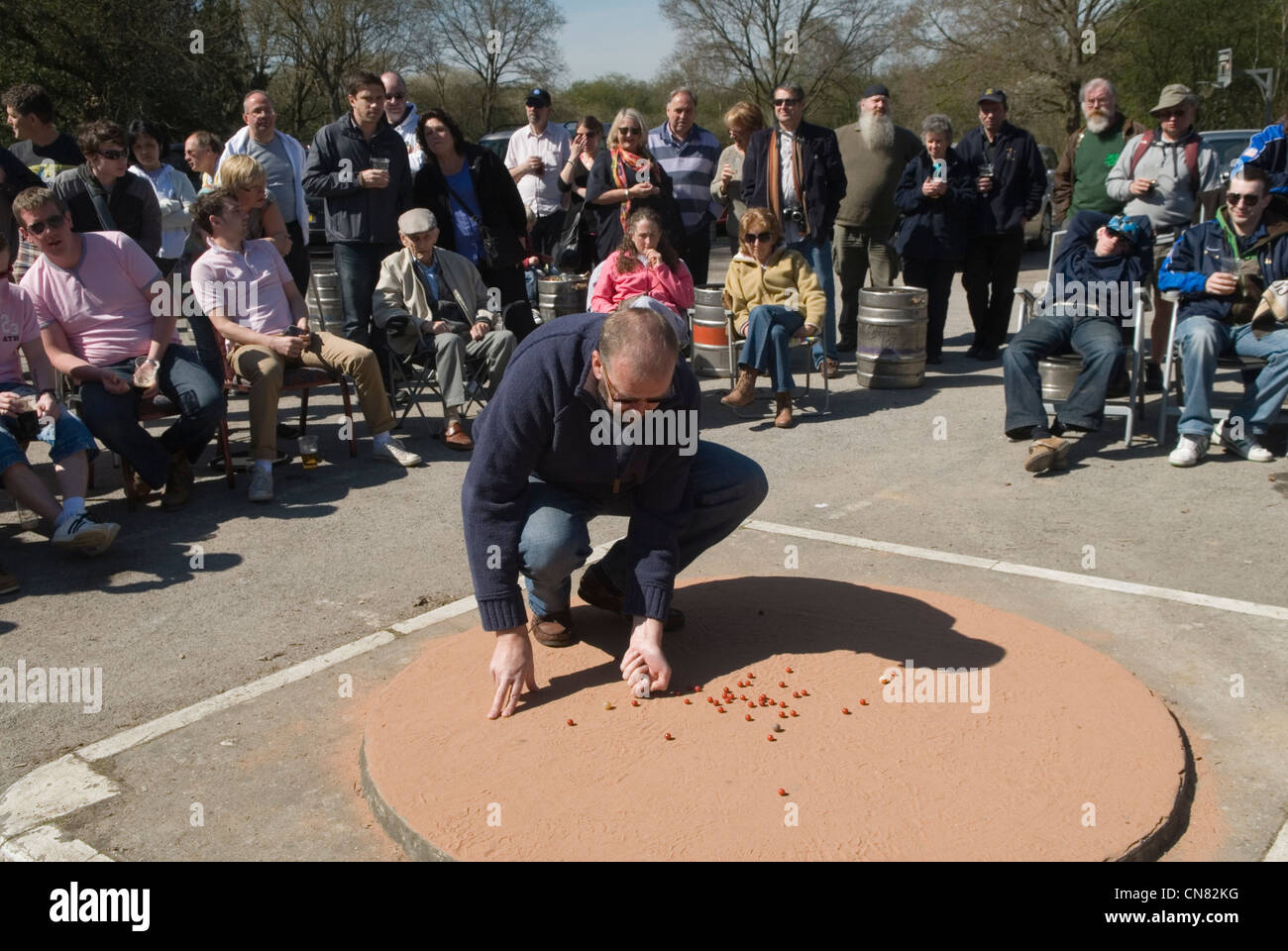 World Champion Marbles Championship Good Friday Tinsley Green Sussex UK. Played outside the Greyhound pub. 2012 2010s UK HOMER SYKES Stock Photo