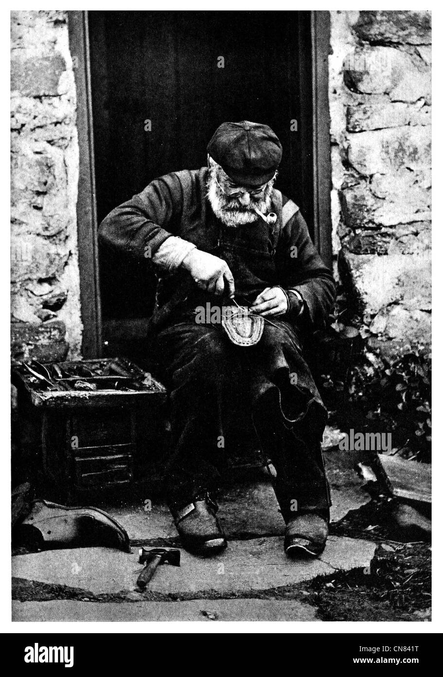 First published 1917 clog repair cobbler shoe coble Stock Photo