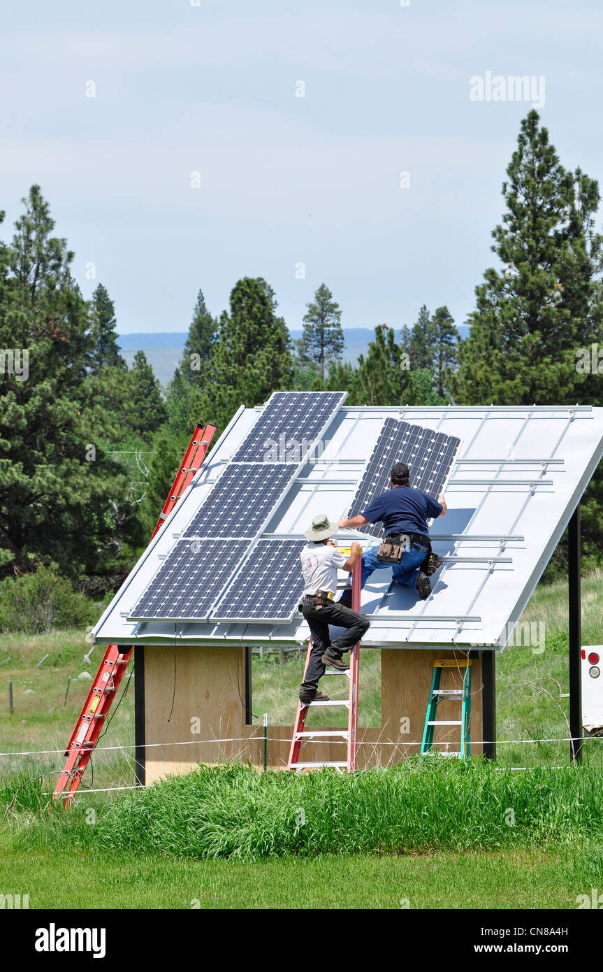 Installing solar panels onto shed in Oregon's Wallowa Valley Stock