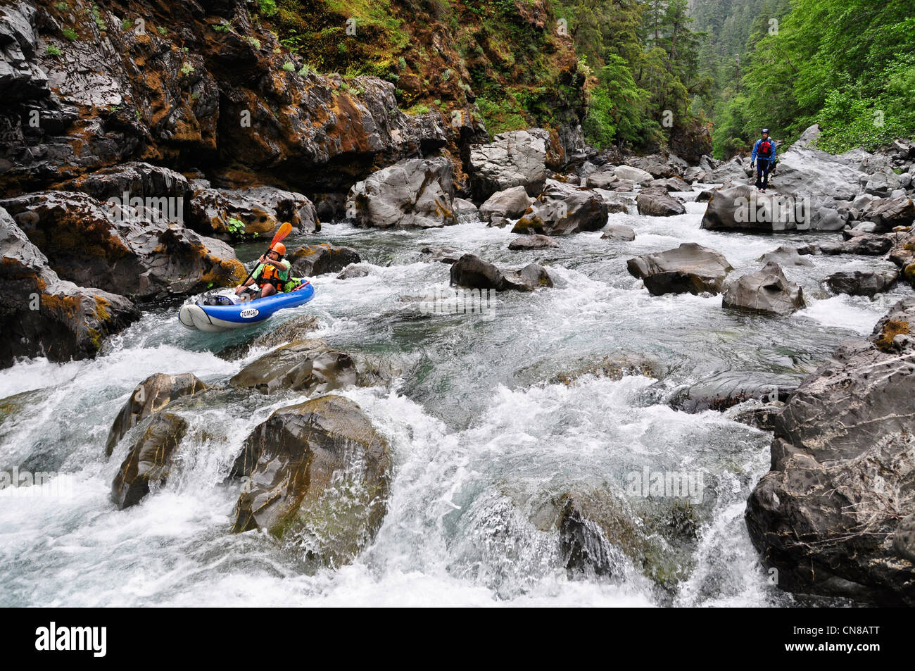 Paddling an inflatable kayak on Oregon's Chetco River Stock Photo Alamy