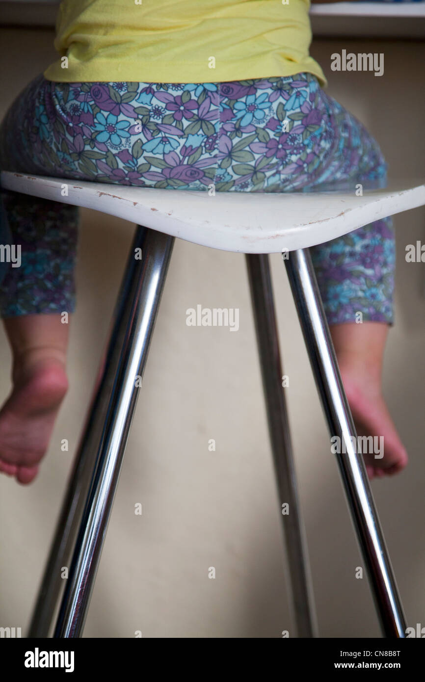 Girls legs hanging off stool Stock Photo Alamy