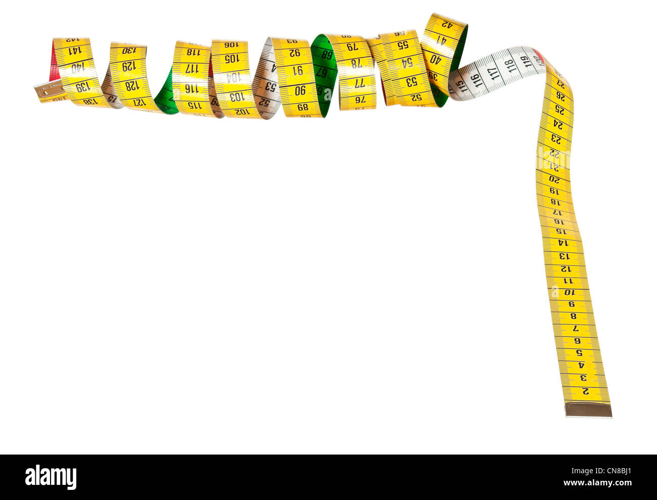 Whirled yellow tape measure isolated on white Stock Photo