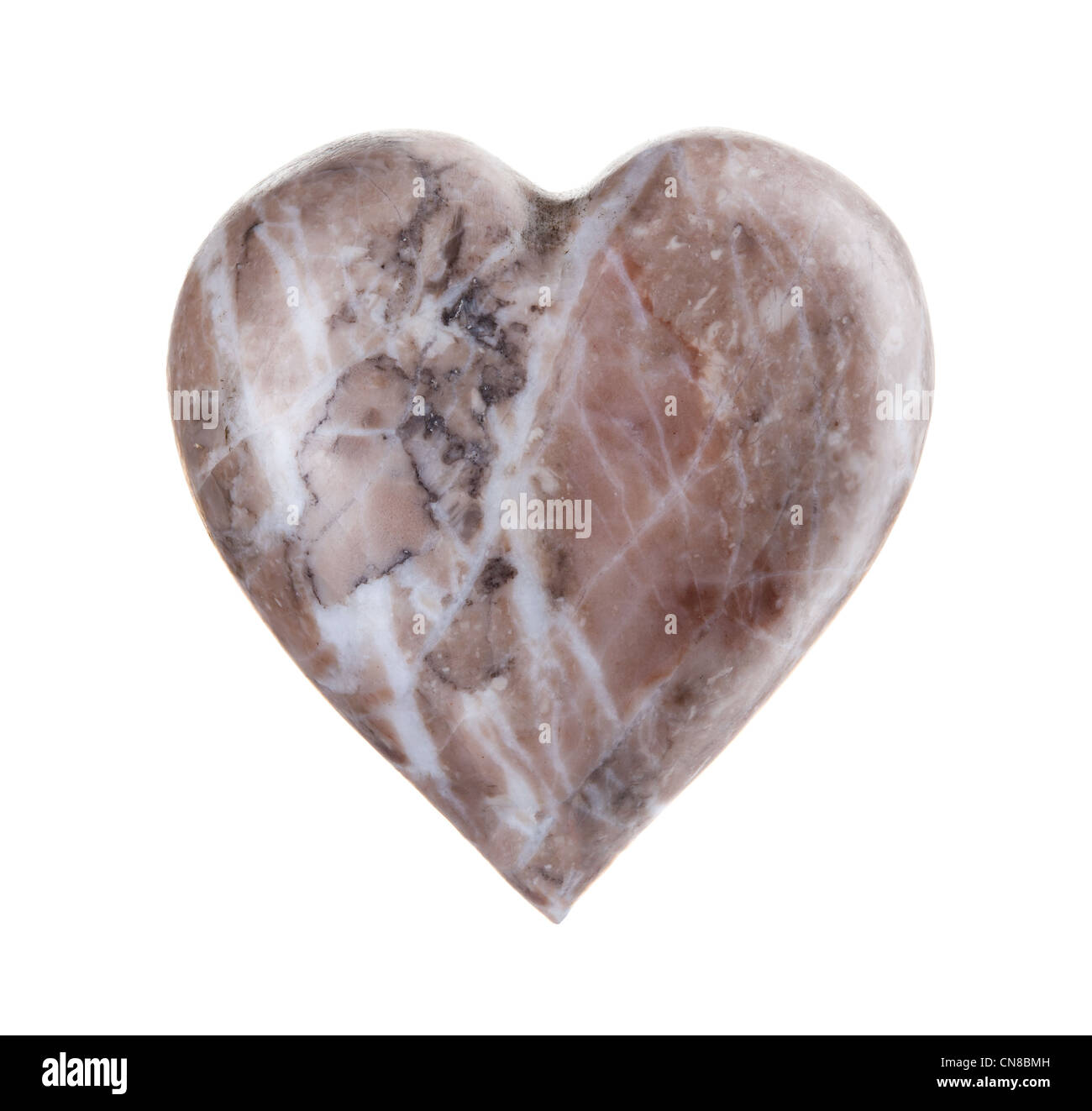 Heart shaped rock over a white background. Stock Photo