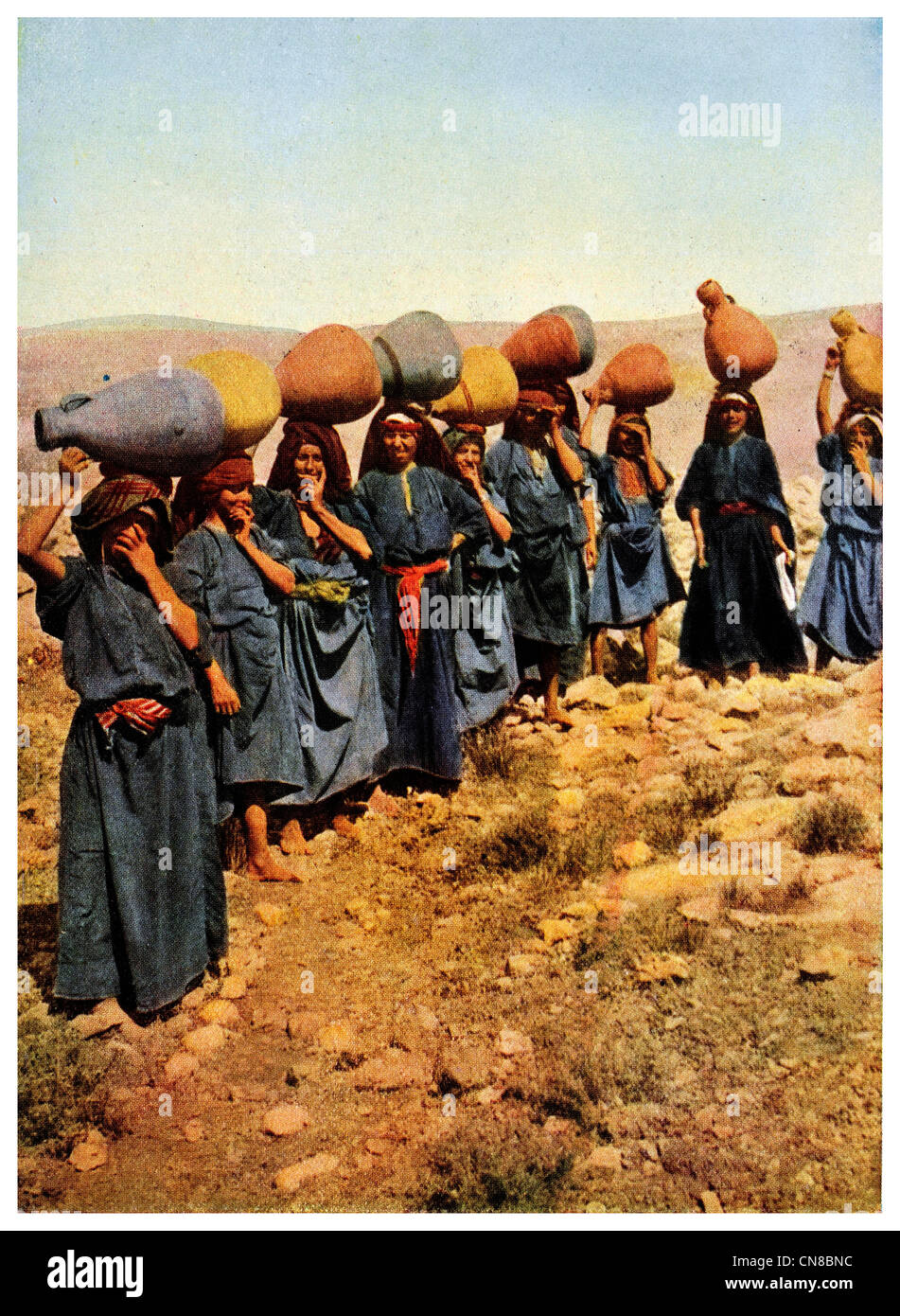 First published 1914  Women water carrier fresh drinking Well Jerusalem Stock Photo