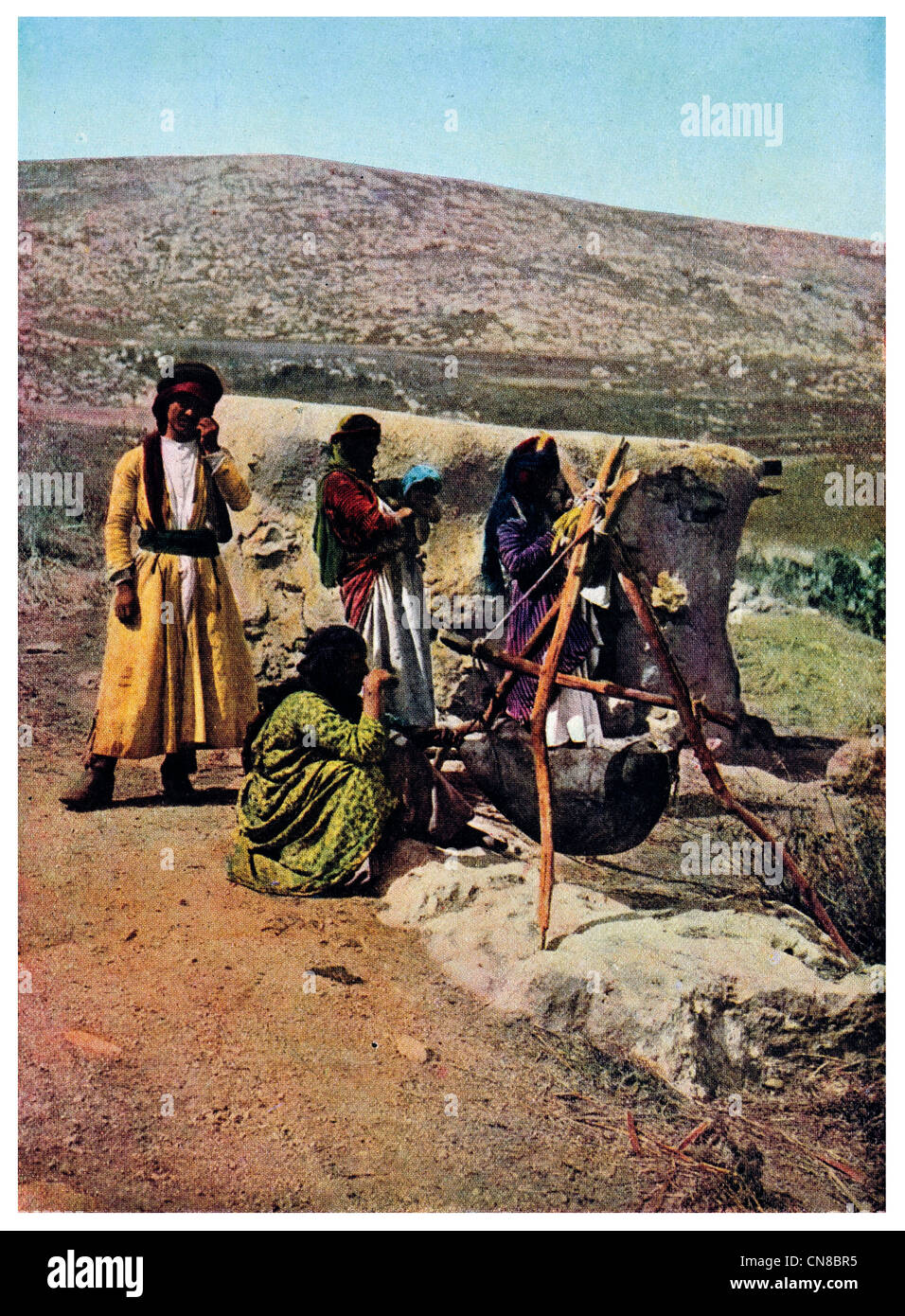 First published 1914 Making Butter Holy Land Stock Photo