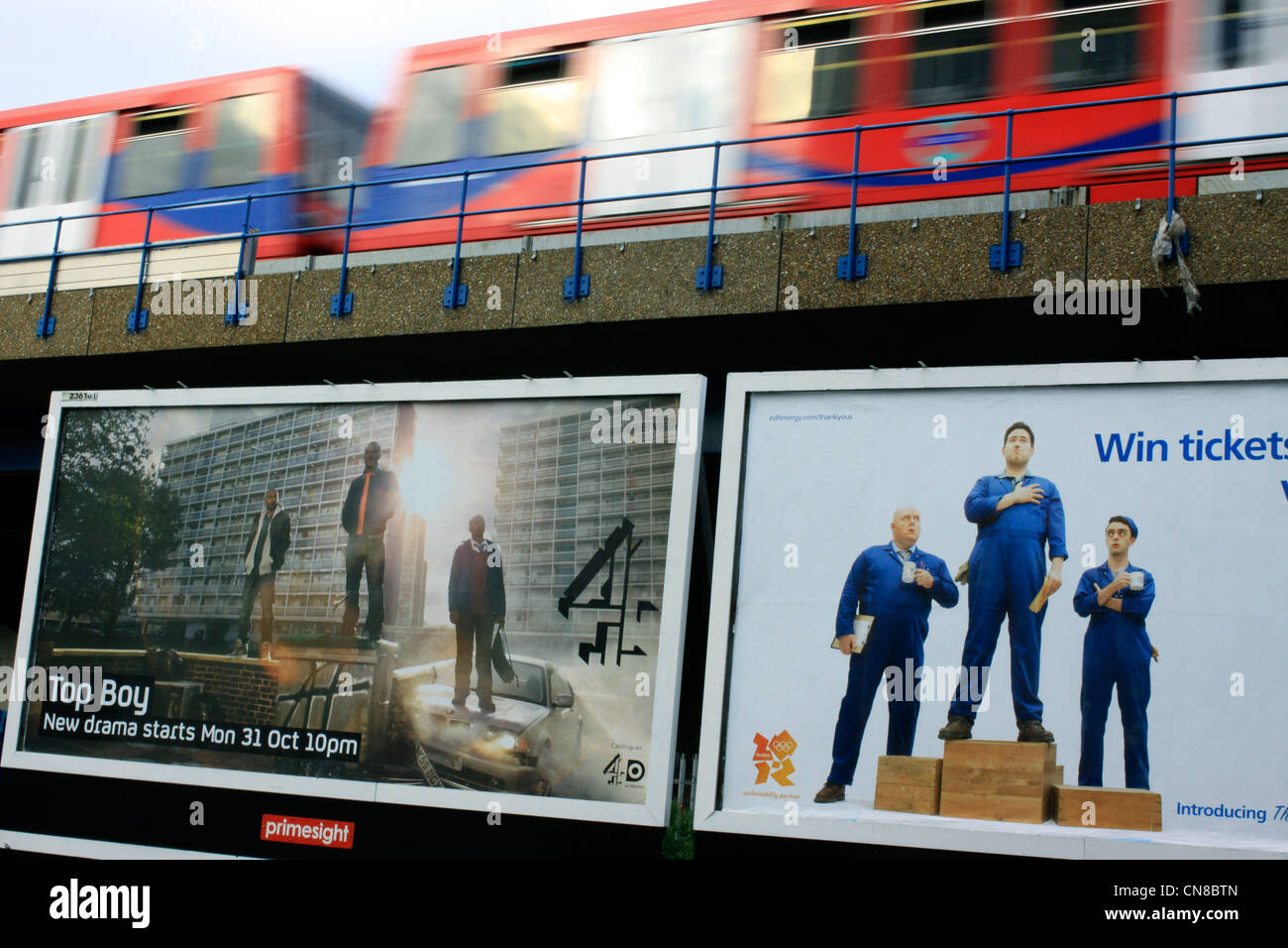 Billboards near the Docklands Light Railway line in East London Stock