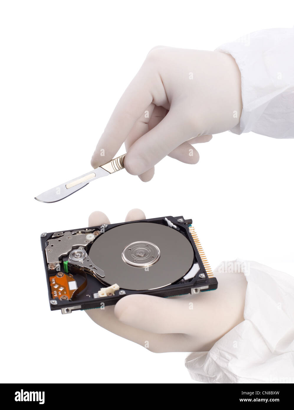 hard disc data partition hand hold scalpel Stock Photo