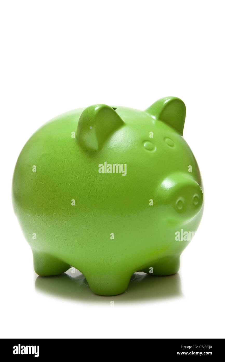 Green piggy bank money box isolated on a white studio background. Stock Photo