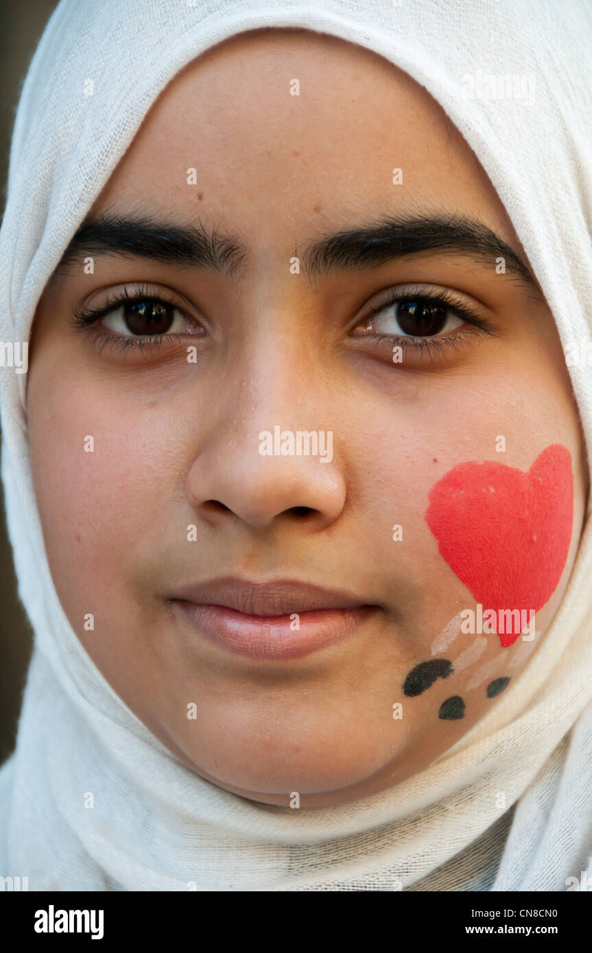 Egyptian teenager with heart and egyptian flag on face - Cairo Stock Photo