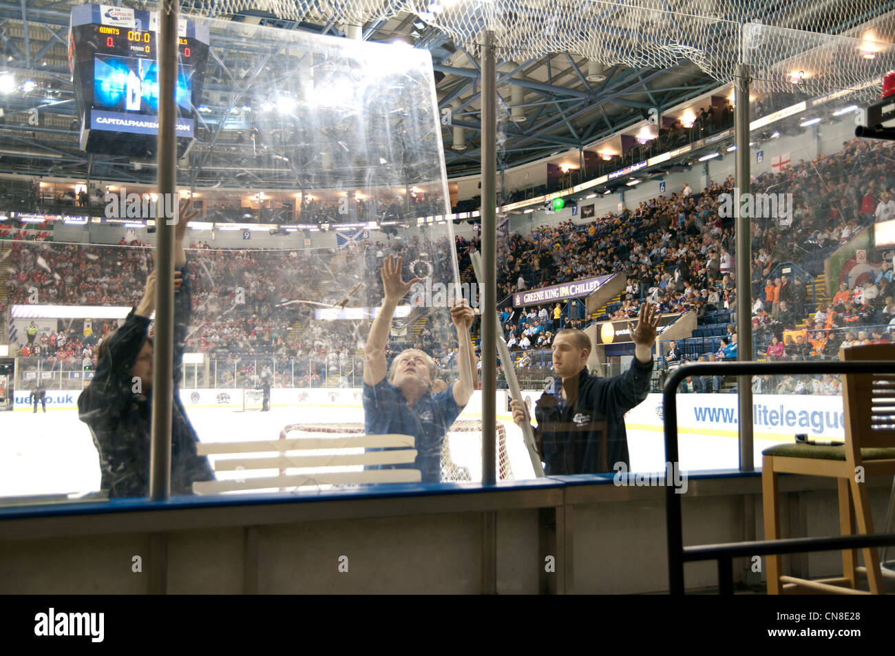 Nottingham Arena staff replacing plexi glass before the first semi final of the Elite Ice Hockey League Playoffs Stock Photo