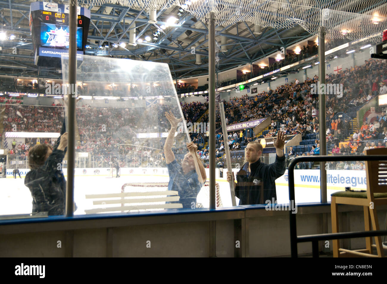 Nottingham Arena staff replacing plexi glass before the first semi final of the Elite Ice Hockey