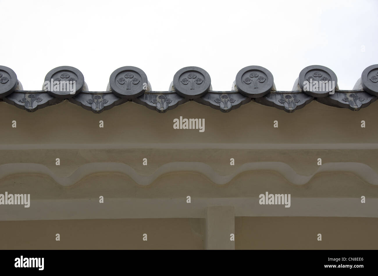 Closeup of round japanese roof tiles seen from below Stock Photo