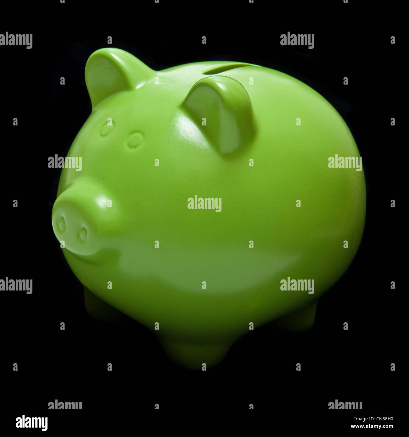 Green piggy bank or money box on a black studio background Stock Photo ...
