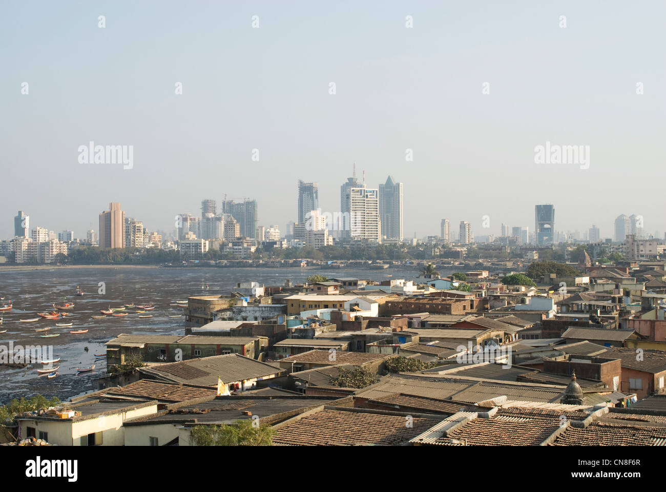 Urbanization Contrast - Slums in the foreground and high rises behind - Mumbai, India Stock Photo