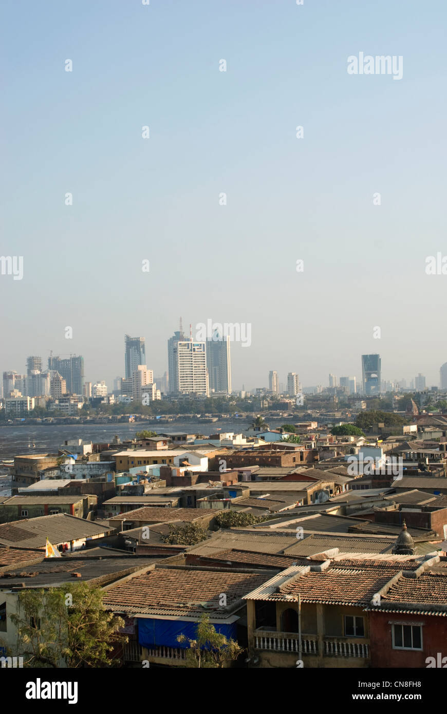 Urbanization Contrast - Slums in the foreground and high rises behind - Mumbai, India Stock Photo