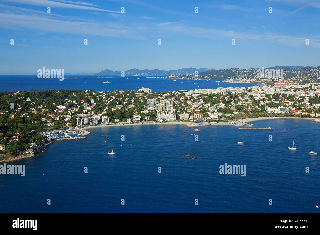 France, Alpes Maritimes, Antibes, Cap d'Antibes, Juan les Pins in the background (aerial view) Stock Photo